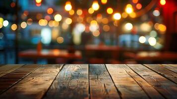 Image of wooden table in front of abstract blurred restaurant lights background, photo
