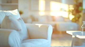 Blurred view of living room interior with white sofa armchair and coffee table photo