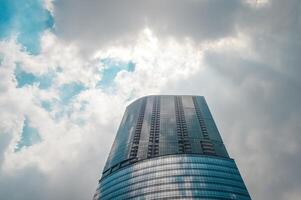 modern highrise building with copy space on a cloudy day photo