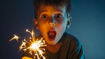 High angle view of scared boy holding sparkler, photo