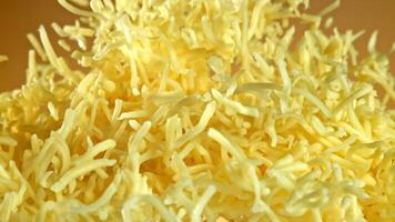 Super slow motion shredded cheese. High quality FullHD footage video
