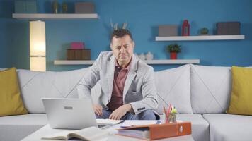 Home office worker man looking at camera curious and confused. video