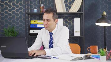 Businessman working on laptop gets satisfied. video