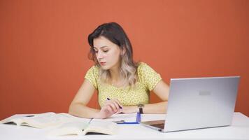 Concentrated woman working on laptop. video