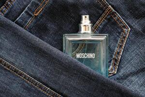 KYIV, UKRAINE - OCTOBER 31, 2023 Moschino Funny blue perfume bottle. Moschino is Italian luxury fashion house founded in 1983 by Franco Moschino photo