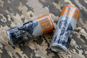 KYIV, UKRAINE - OCTOBER 31, 2023 Non Stop energy drink with limited edition design of Stalker and character with gas mask on aluminium tin can photo