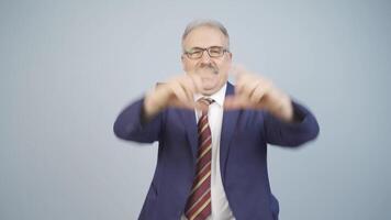 Businessman making heart at camera. video