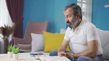 Man talking to himself at home. video