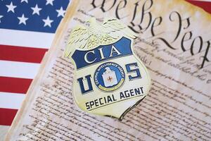 KYIV, UKRAINE - MARCH 9, 2024 US CIA Central Intelligence Agency badge with United States Constitution on flag photo