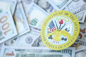 KYIV, UKRAINE - MARCH 9, 2024 US Department of Army seal on many US hundred dollar bills photo