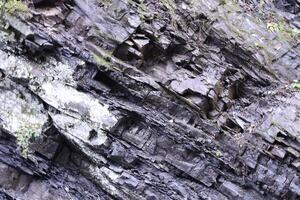 texturizado áspero rocas con lote de pequeño detalles foto