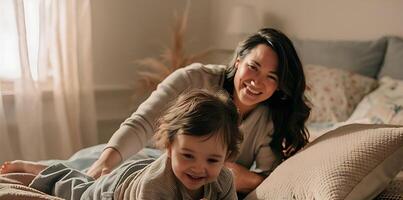 Mother and child are playing in bedroom image photo