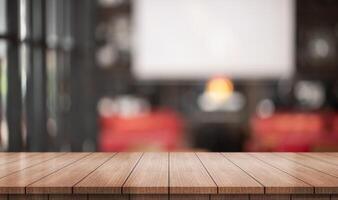 Empty wooden table top with lights bokeh on blur restaurant background. photo