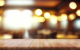 Empty wooden table top with lights bokeh on blur restaurant background. photo