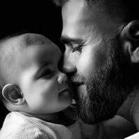 Father holding his baby in a tender moment suitable for family-themed advertising photo