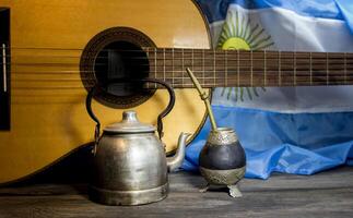 yerba mate, guitar and fried pastries, symbols of the Argentine tradition photo