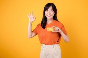 Happy female shopper in her 30s using a smartphone and credit card for convenient online purchases. Modern lifestyle and technology photo