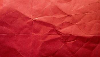 a red crumpled paper texture with a small hole photo