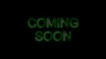 Coming Soon Green Electric Glow Neon Text Animation on Black Background. Modern Light Design. 4K UHD video