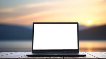 Laptop with white blank screen on wooden table with blurred background photo