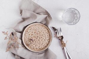 Orthodox fasting before Easter, empty plate, cutlery and glass of water top view photo