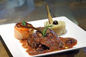 Duck confit with jabuticaba sauce photo