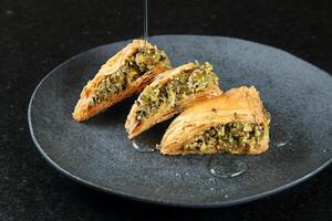 Pistachio puff pastry with honey, classic Arabic sweet photo