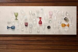 glasses, platters, bowls and kitchen objects seen from above on the table photo