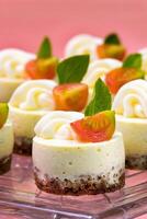 cream cheese and cherry tomato canape on tray photo