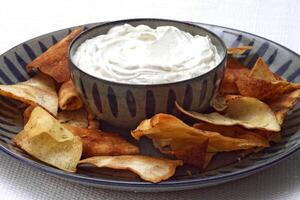 dry curd with toasted bread in bowl photo