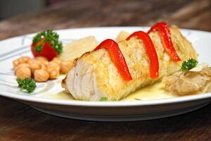 Baked cod with peppers and potatoes photo