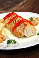 Baked cod with peppers and potatoes photo