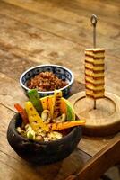 roasted vegetables with roasted curd cheese and red rice photo