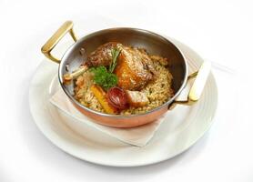 Maria Isabel chicken with rice, bacon, sausage and fried cassava photo