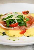 cheese ravioli with Parma ham photo