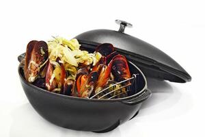 Moules Frites Mariniere with caramelized onions and sauce photo