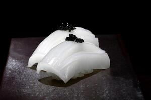 squid and black salt sashimi photo