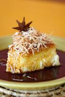 tapioca pudding with caramel sauce and grated coconut photo
