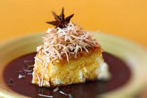 tapioca pudding with caramel sauce and grated coconut photo