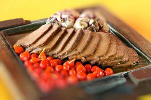 carne de sol, typical northeastern Brazilian dish with tomatoes and fried cassava photo