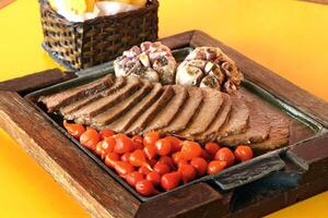 carne de sol, typical northeastern Brazilian dish with tomatoes and fried cassava photo