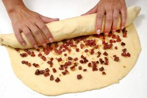 preparation and finishing of sausage bread photo