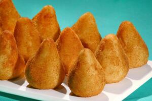 chicken coxinha, classic Brazilian snack with fried dough stuffed with shredded chicken photo