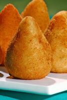 chicken coxinha, classic Brazilian snack with fried dough stuffed with shredded chicken photo