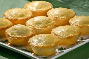 shrimp pies baked in the oven on the tray photo