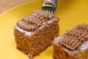 square walnut cakes with walnut cream icing photo