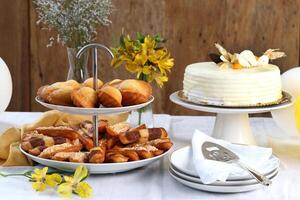 madeleines and white chocolate cake on the table photo