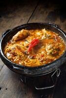 moqueca capixaba, typical dish from the Brazilian region with palm oil and fish with pepper photo
