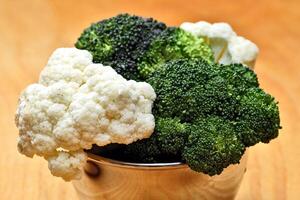 cauliflower in bowl for preparing dishes photo