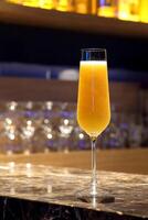 Bellini, refreshing drink with peach, lime and prosecco photo